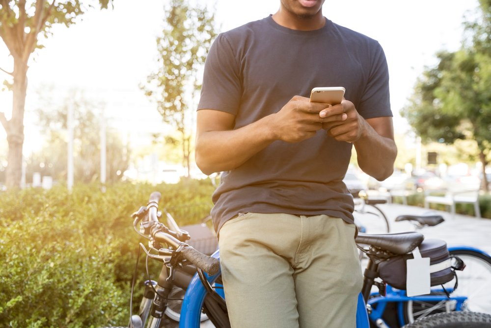 guy using a cell phone outside